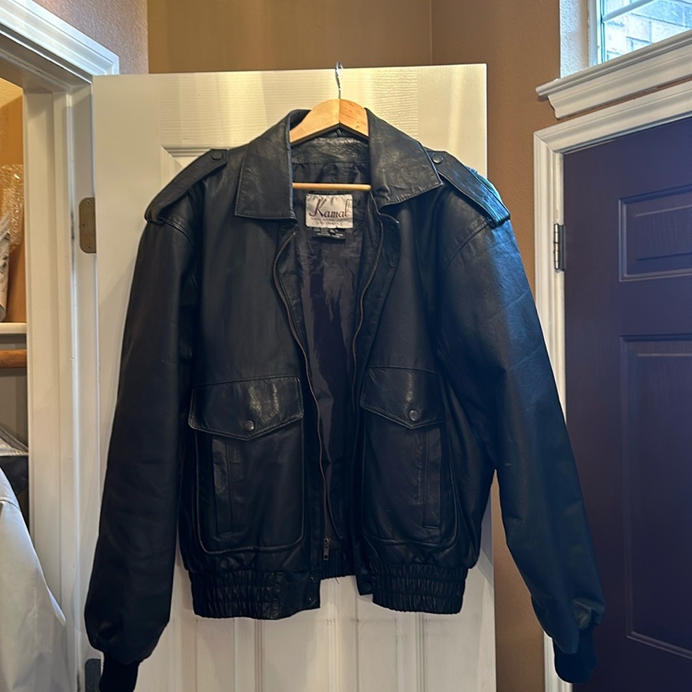 Geniune leather. Lining is 50% nylon 50% acetate